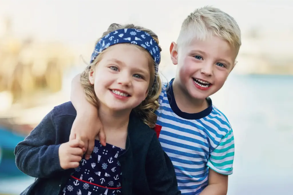 Happy kids smiling together, representing friendly pediatric dental experience on Minimally Invasive Treatment