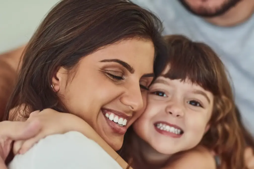 Mother and child smiling together, representing family-focused pediatric dental care