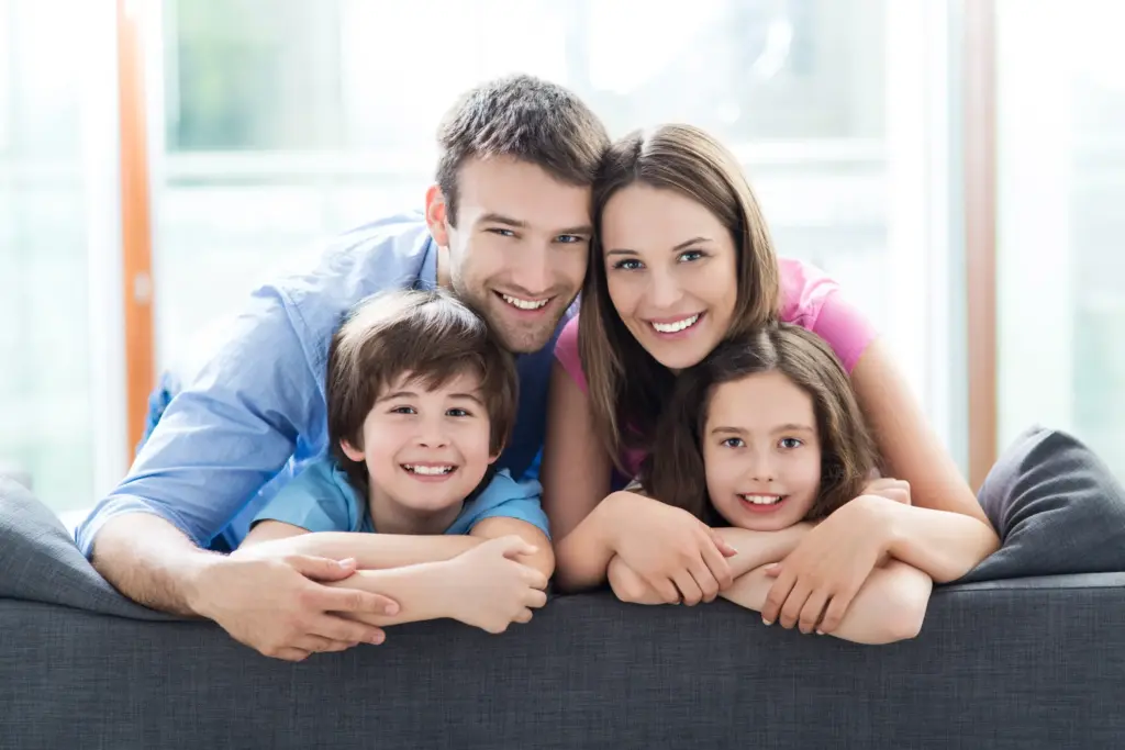 Happy family with children, representing trusted Dental Services in Carrollton, TX