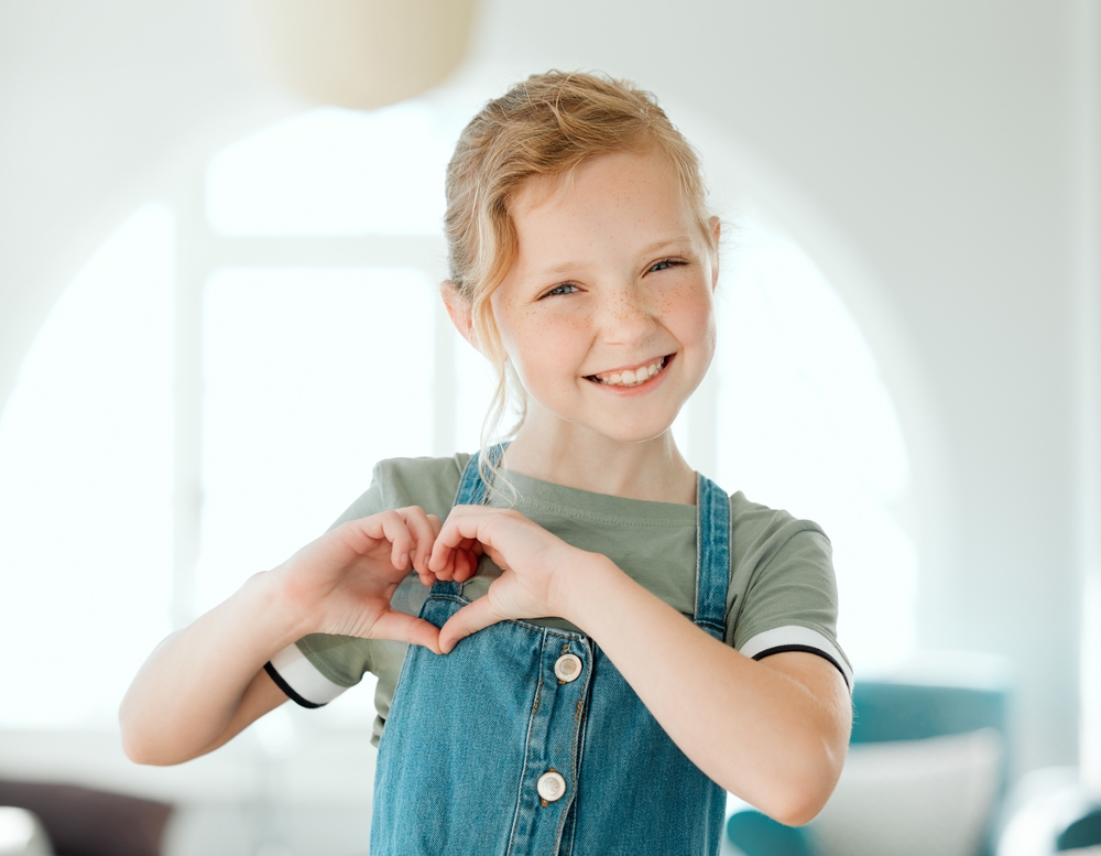 child smiling happily after a gentle Pediatric Dentistry